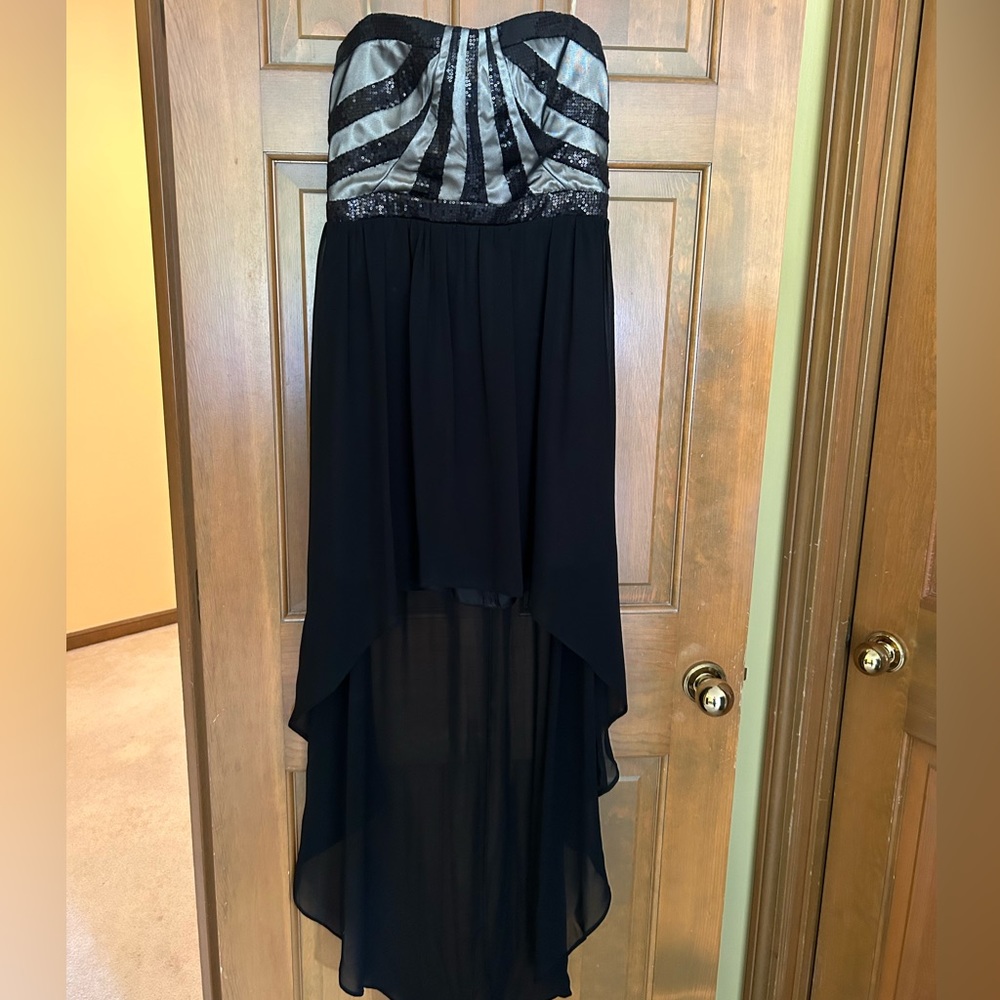 Black and tan dropped-back cocktail dress